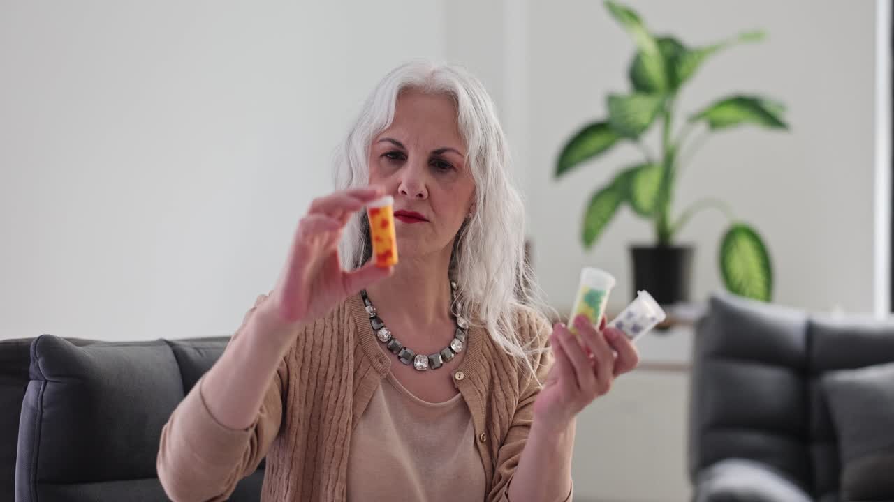 Senior woman holding prescription medication