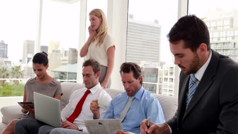 Business-team-sitting-in-staff-room