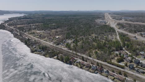 Icy-Lake-Magog-In-Winter---Quiet-Vast-Landscape-Of-Alberta-In-Canada---aerial-shot