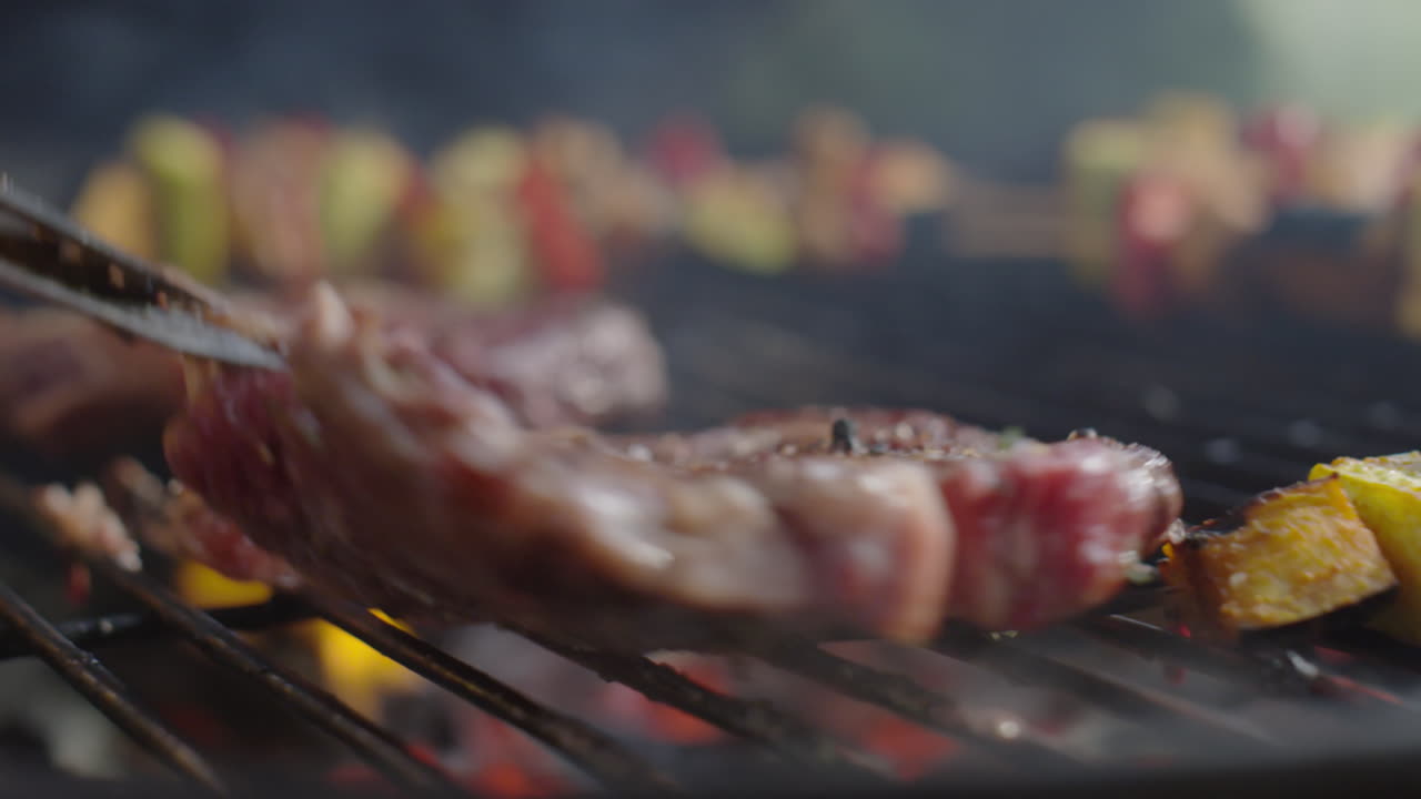 Turning Beef Steaks on BBQ