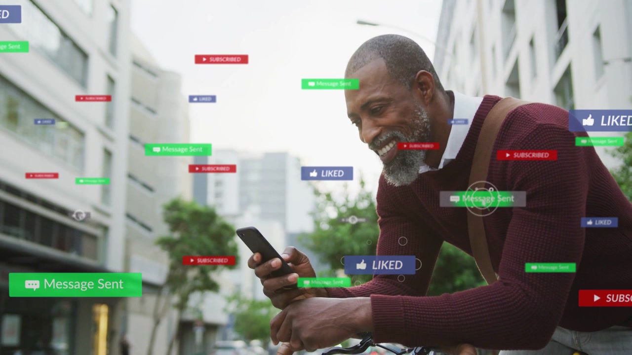 Man leaning on bicycle on city street, scrolling phone, smiling as social media badges clustering