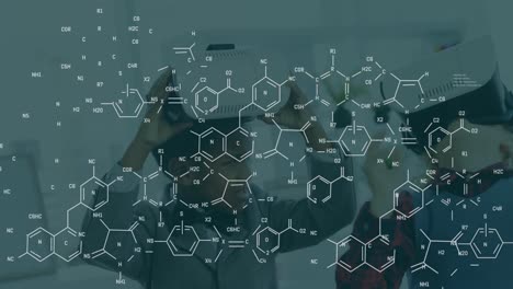 Animation-of-chemical-formulas-over-african-american-boy-using-vr-headset