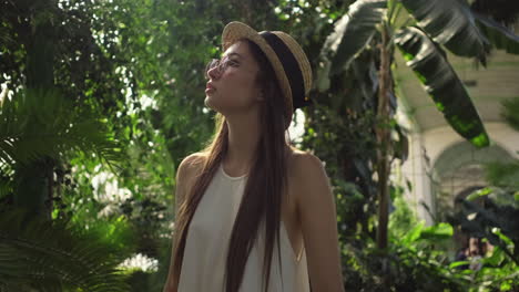 woman in a tropical greenhouse