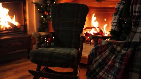 cozy christmas living room with a rocking chair by the fireplace