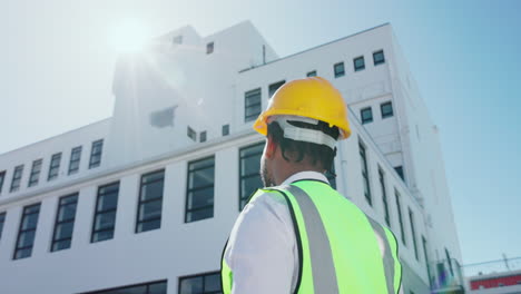 construction worker inspecting a building site