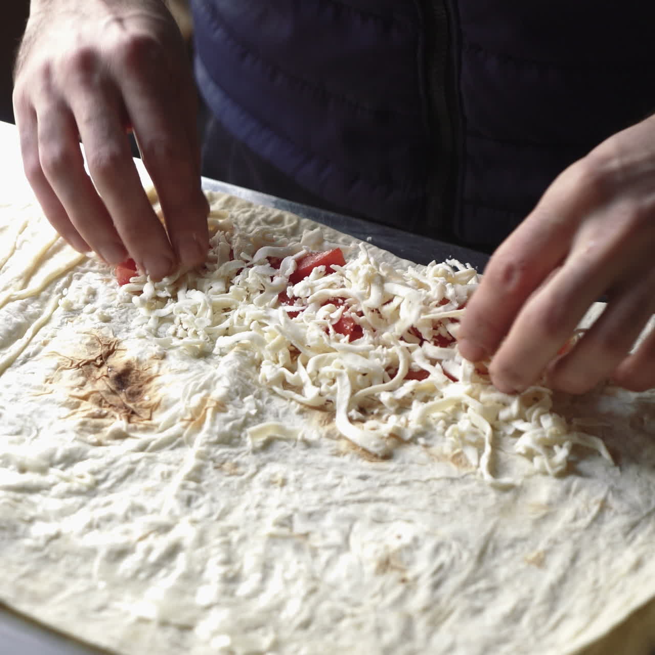 Lavash rolls with cheese and tomatoes. ?hef turns the pita with stuffing. Healthy breakfast concept. Sqare video