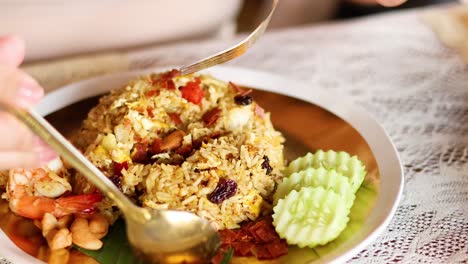 serving pineapple rice with shrimp and cashews