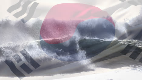 digital composition of waving south korea flag against waves in the sea