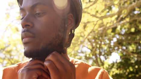 close up of man is fastening his bike helmet