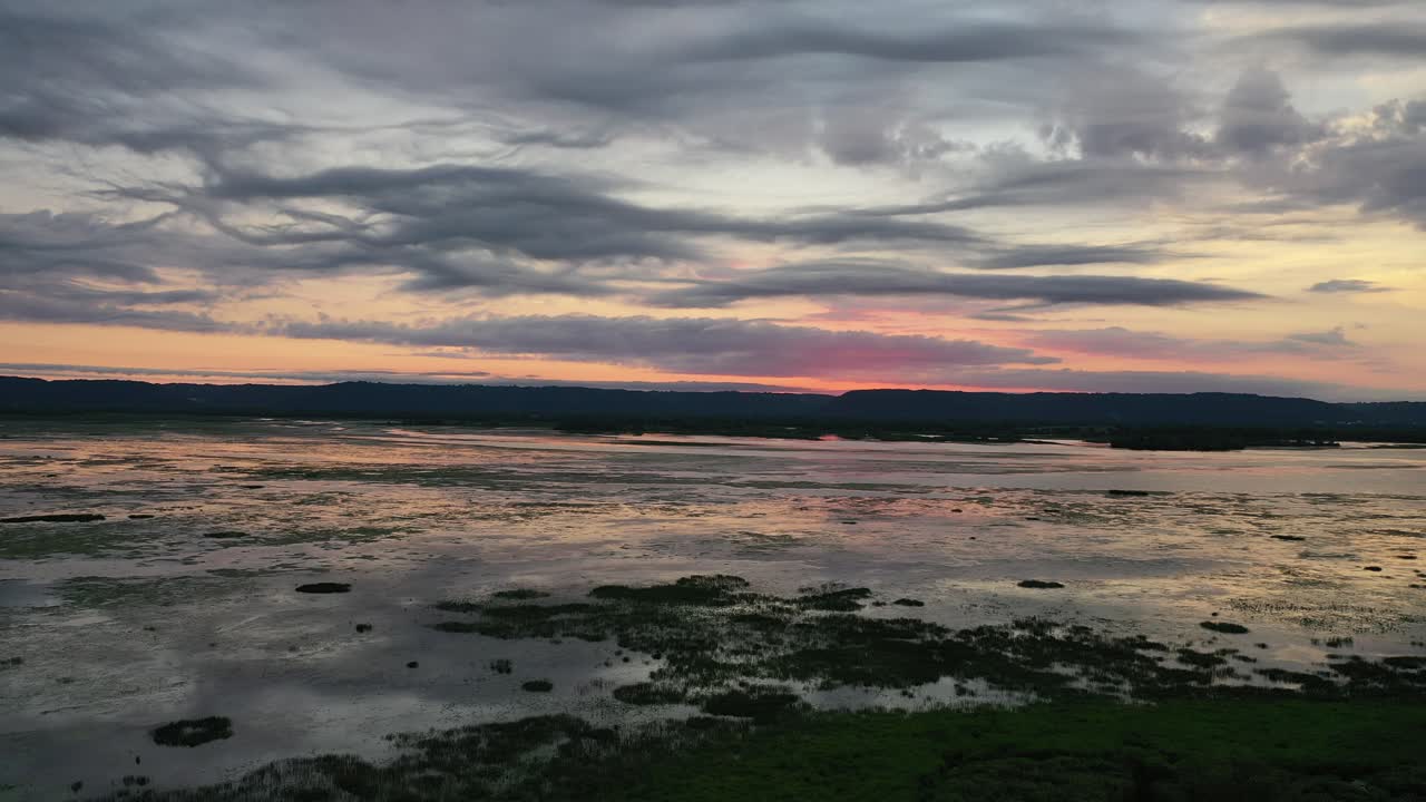 Aerial View of a Serene Wetland Marsh at Sunset