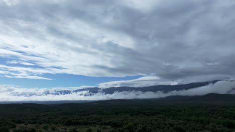 scenic mountain landscape with clouds and forest