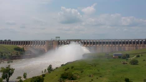 resevoir dam wall with sluice gates overflowing 4k 30fps