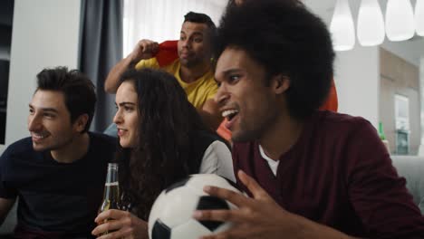 handheld video of football fans watching an exciting match