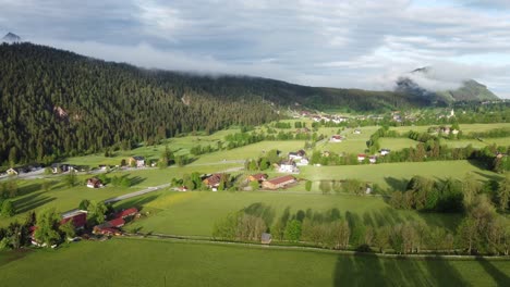 4K-drone-shot-of-beautiful-misty-sunrise-at-Ramsau-am-Dachstein,-Styria,-Austria