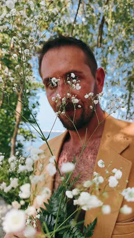 man in a beige jacket with flowers