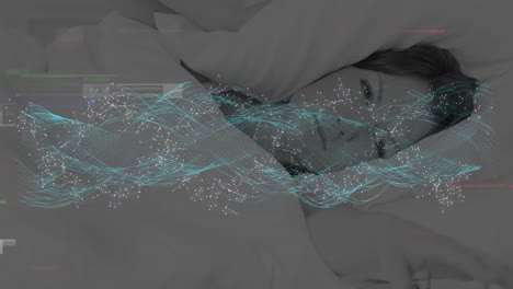 animación de la técnica de glitch, puntos y ondas formando una hélice de adn sobre una mujer caucásica acostada en la cama