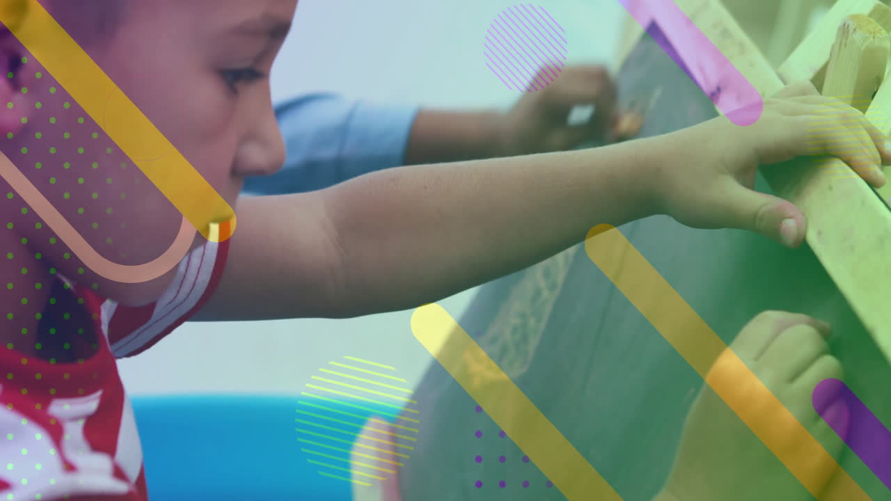 Child drawing on chalkboard with colorful shapes animation overlaid