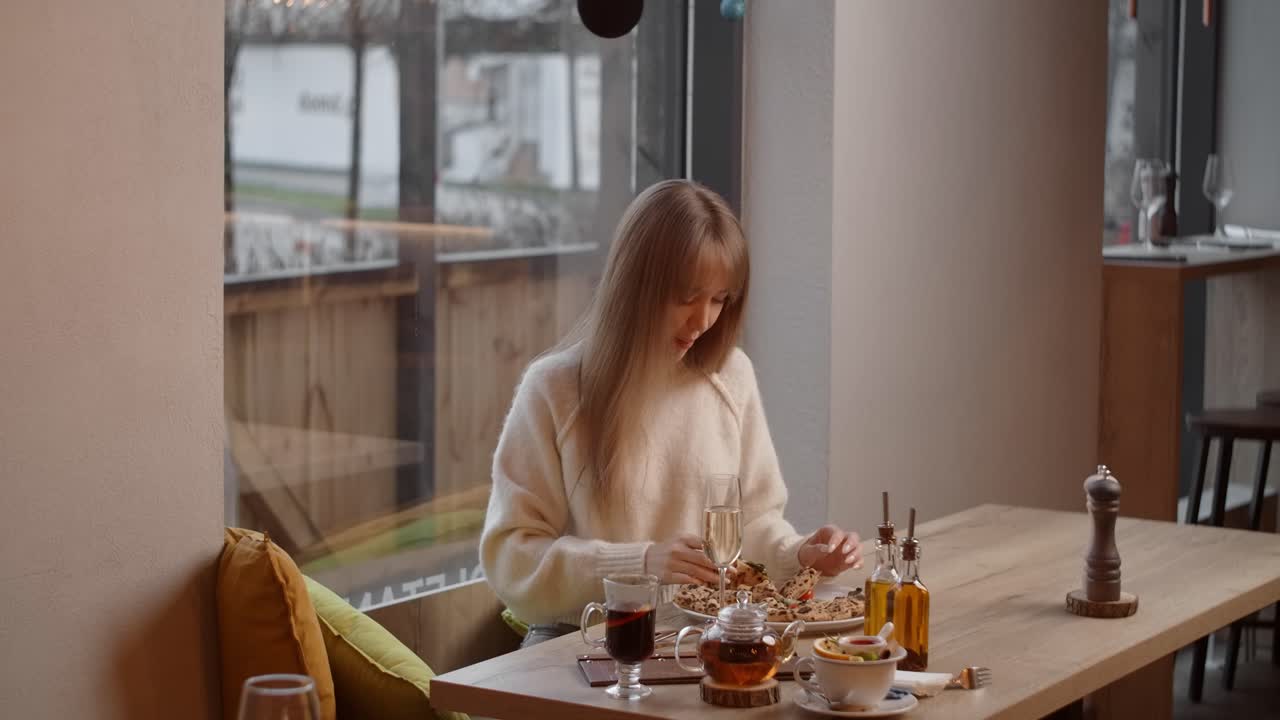 Woman enjoying a meal in a cozy cafe