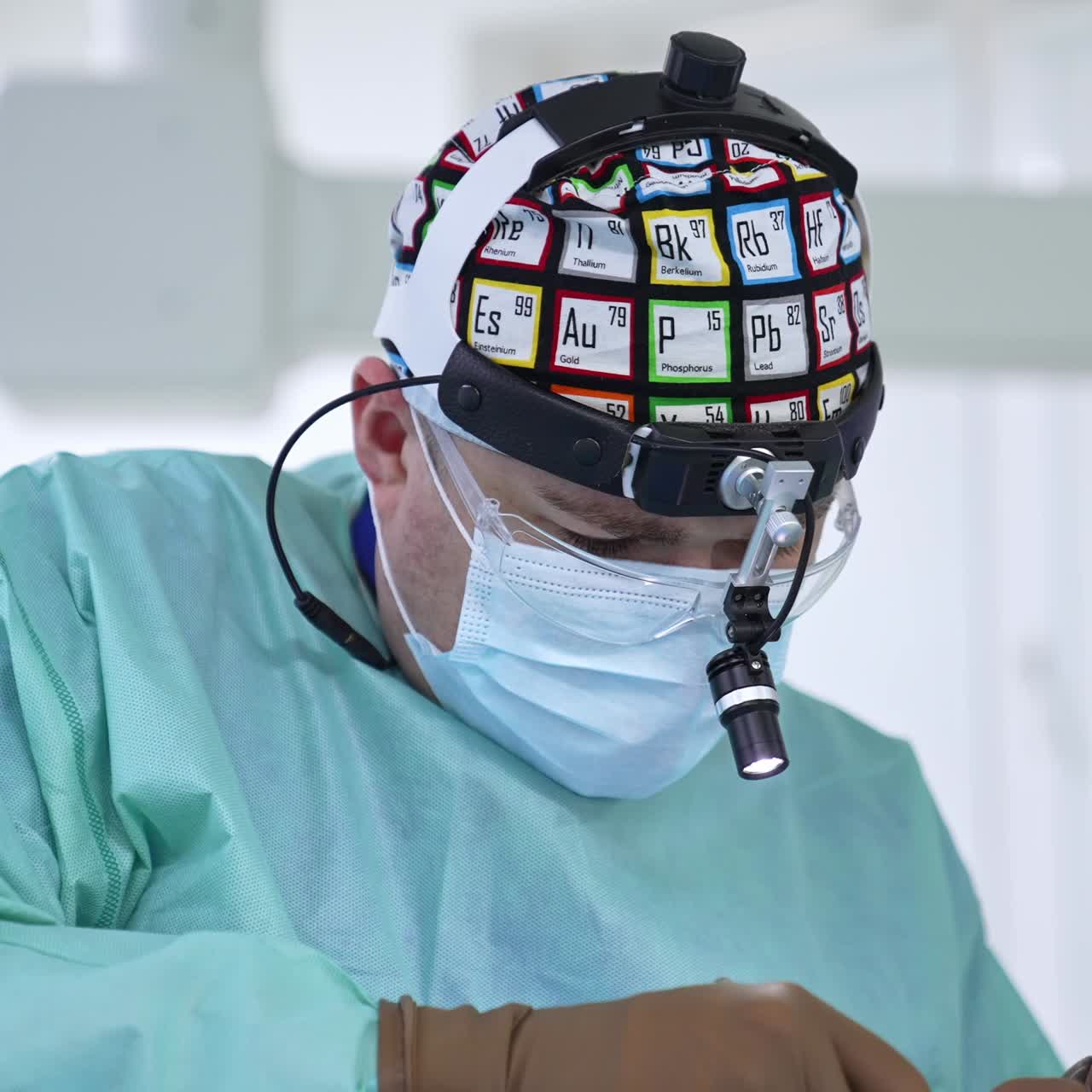 Busy surgeon applying tools for nasal septum operation. Performing otolaryngology operation in modern surgery room