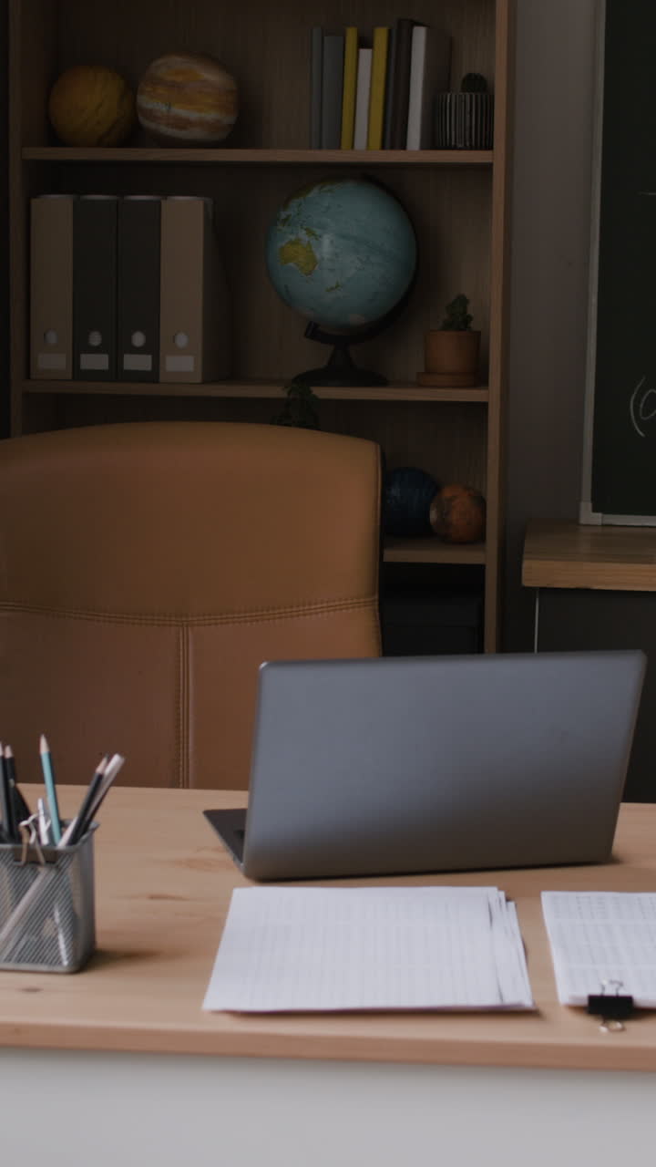 Classroom Workspace with Laptop and Supplies