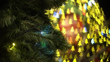 artificial christmas tree with colorful bokeh light.