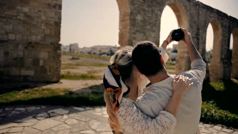 young tourists couple taking selfies with camera on summer holidays