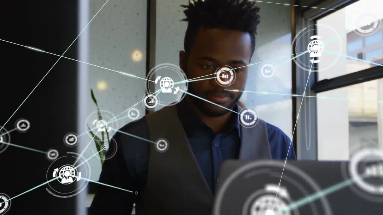 Animation of networks of connections and businessman using laptop