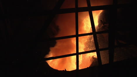 molten metal poured to industrial cauldron. molten steel pouring