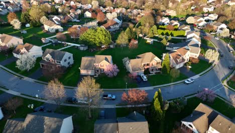 truck driving through american neighborhood during spring sunset