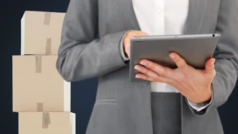 Animation-of-midsection-of-woman-using-tablet-with-stacks-of-boxes-on-blue-background