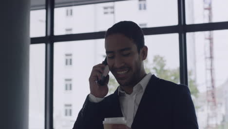 Young-business-man-on-call-on-phone-arriving