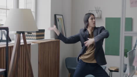 happy man dancing in the office