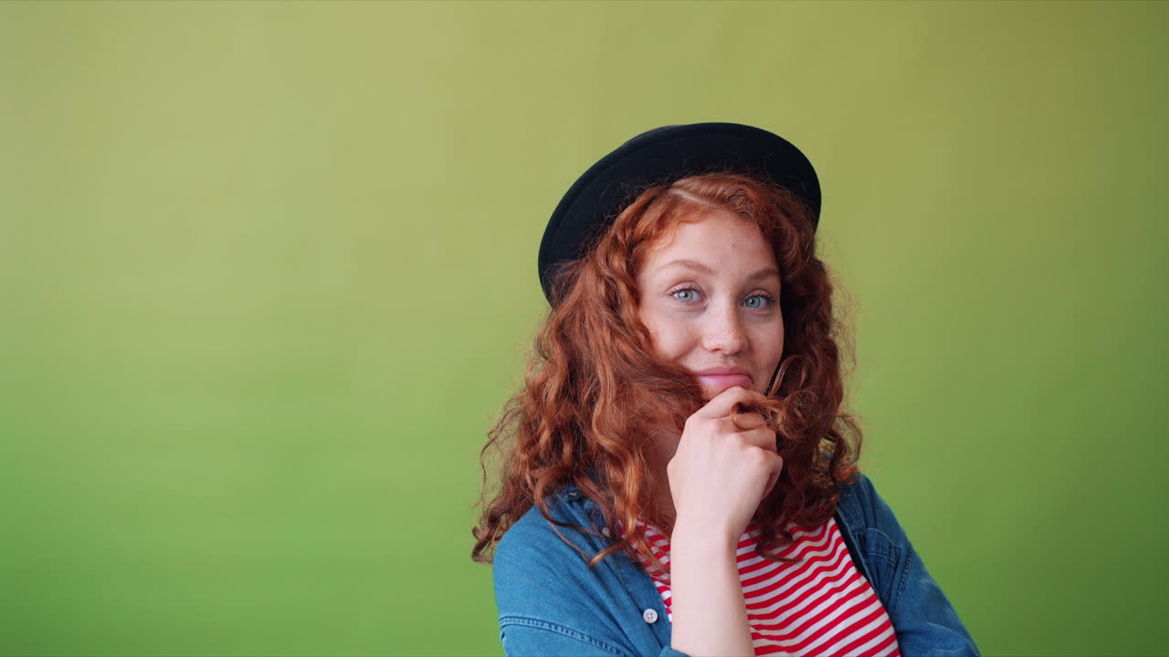 Young Woman with Red Curly Hair and Black Hat