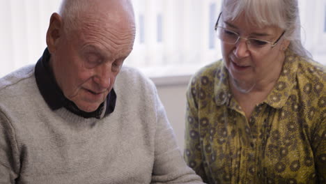 elderly people reading a book
