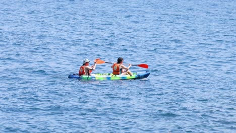 two people kayaking in sorrento, naples, italy