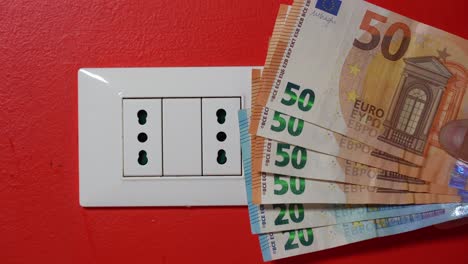 europe, italy , increase in the cost of bill for  gas and electricity causes increased price for the procurement of raw materials, money euro banknote and domestic heating radiator