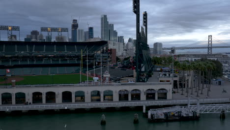 overlooking oracle park, san francisco skyline, and bay bridge at dusk