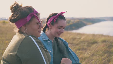 overweight woman and girlfriend spend time near river