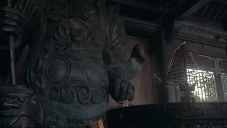 incense smoke and warrior statue in bai dinh temple vietnam