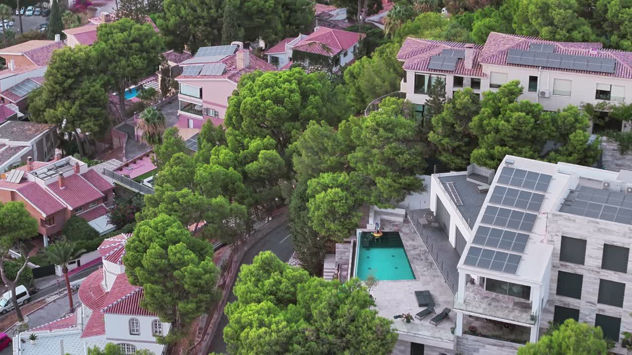 modern hillside homes with solar panels and pool in Malaga