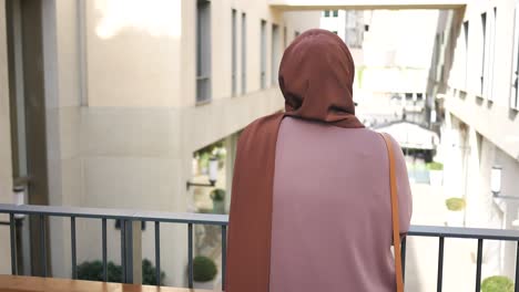 woman in hijab looking at a street view