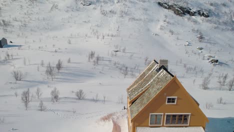 myrdal snowy village in norway, colorful house, aerial rise reveal mountain, winter magical travel in scandinavia, drone aerial