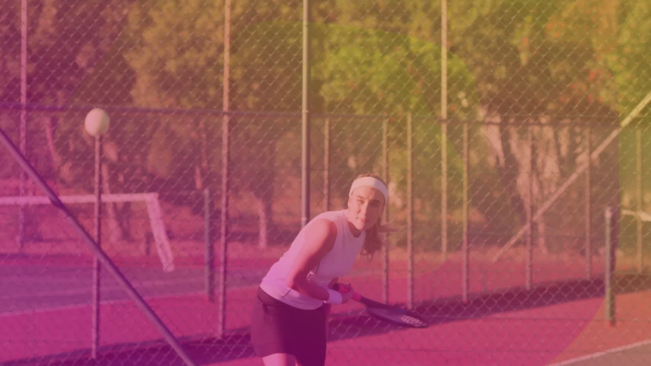 female tennis player gripping racket on court showing animated ball trajectory for sports analytics