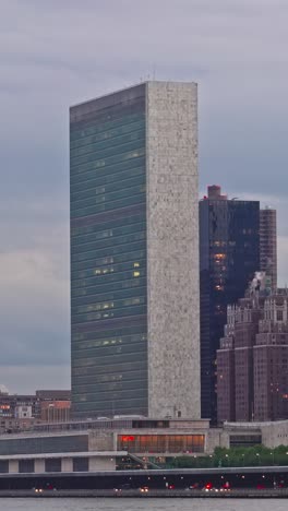 the manhattan skyline rises over the east river