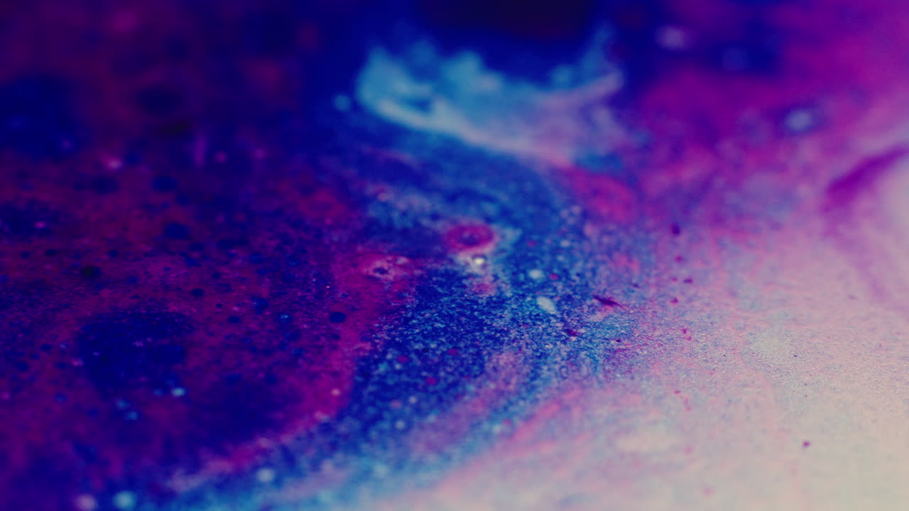 Colourful, organic, liquids macro shots buzzing and flowing