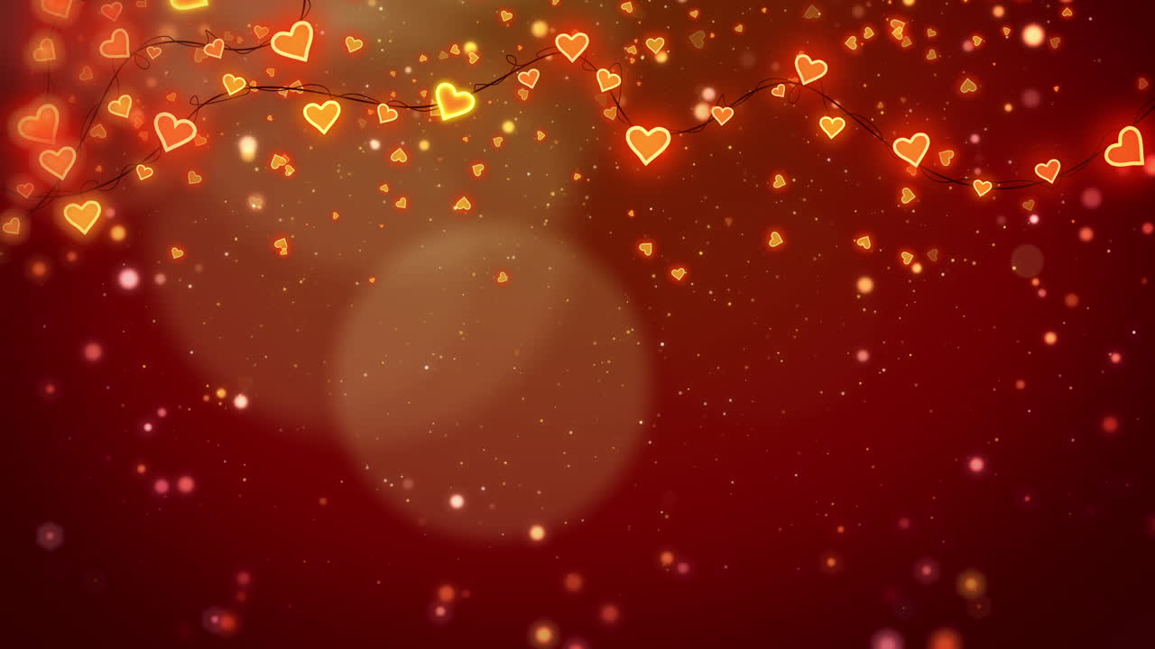 Red romantic animated background with a glowing garland of hearts. Flying particles and soft bokeh. Copy space. Looped motion graphics.