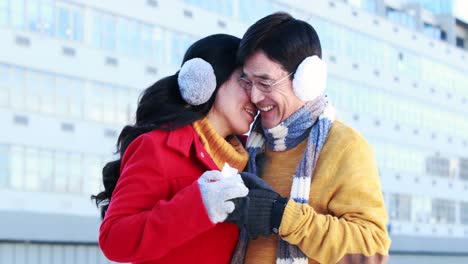 asian man giving a present to his wife