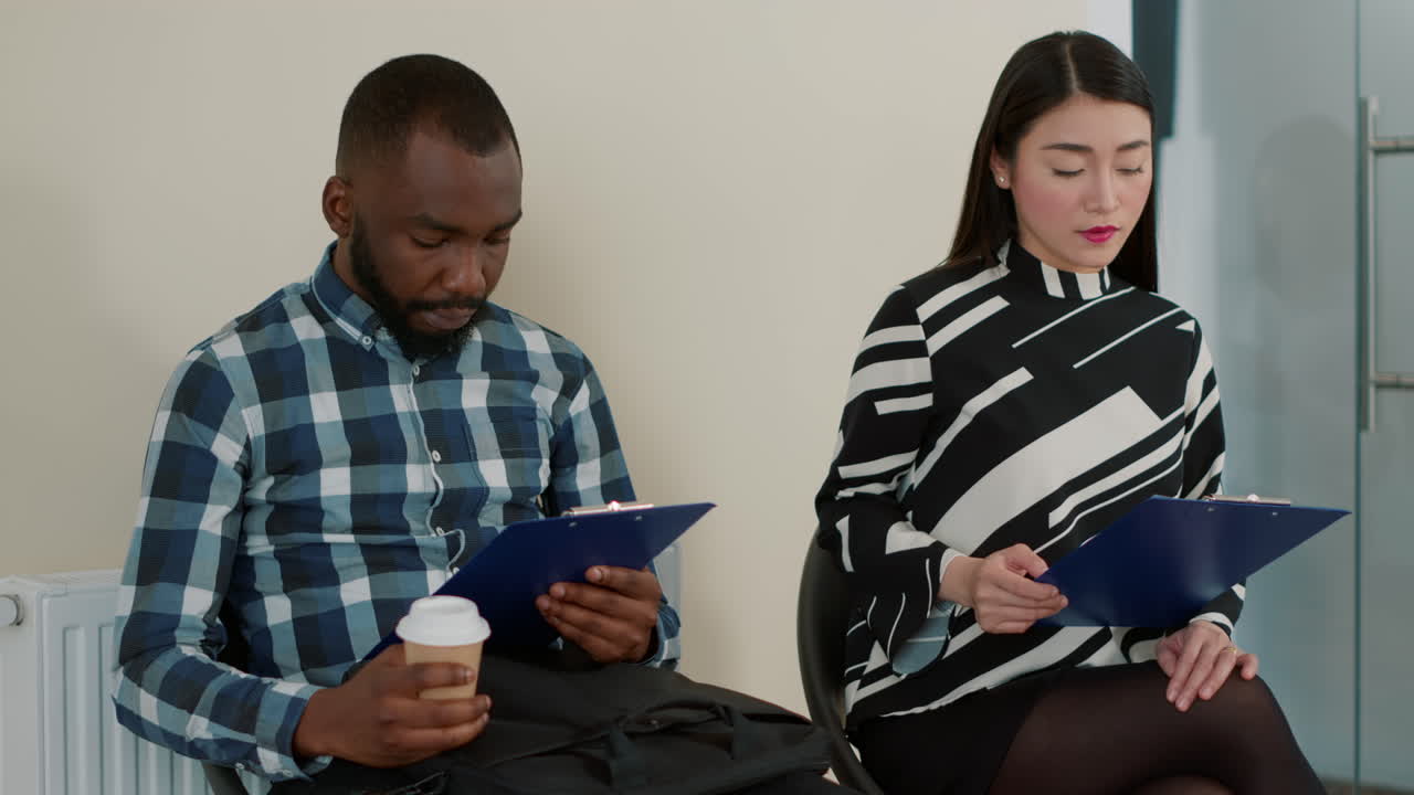 Multiethnic group of people waiting in queue at job interview