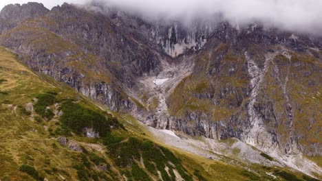 small glaciar remaining on austrian mountains in hochkonig, aerial drone shot