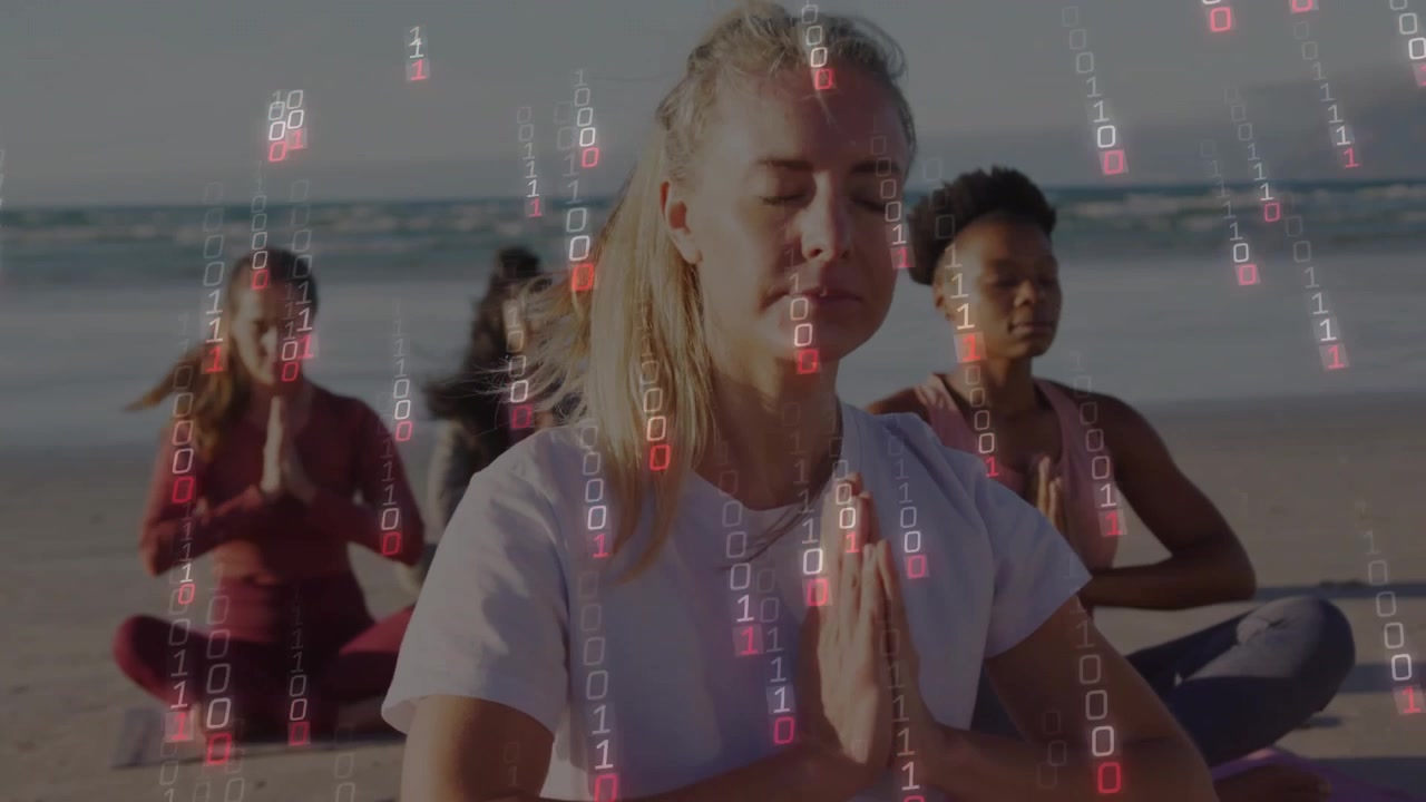 Diverse vrouwen mediteren op het strand met digitale binaire code